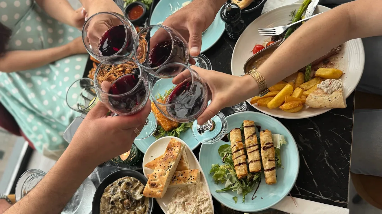 Melis dining table with food and wine